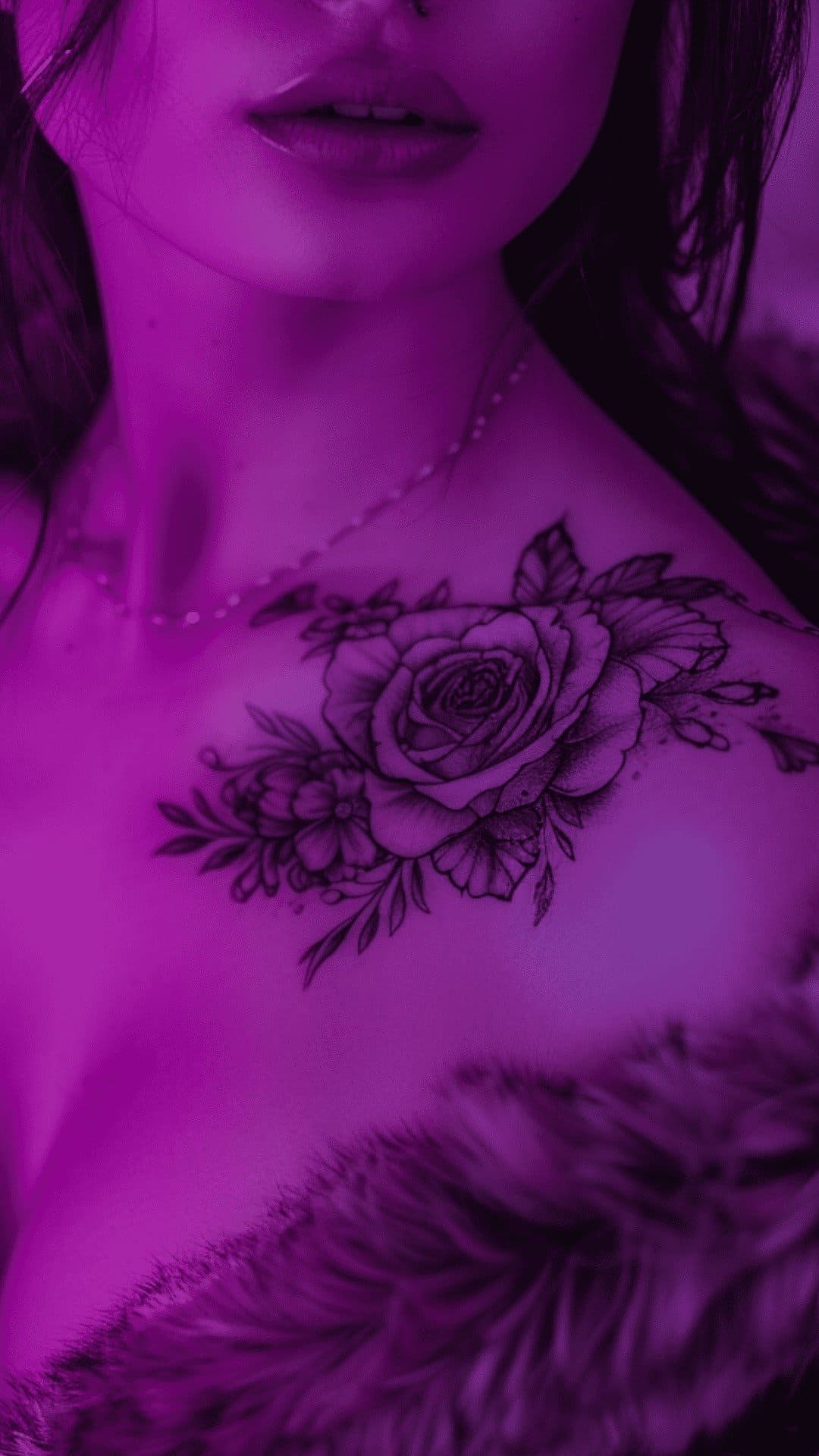 Fineline rose tattoo arounв female's shoulder.