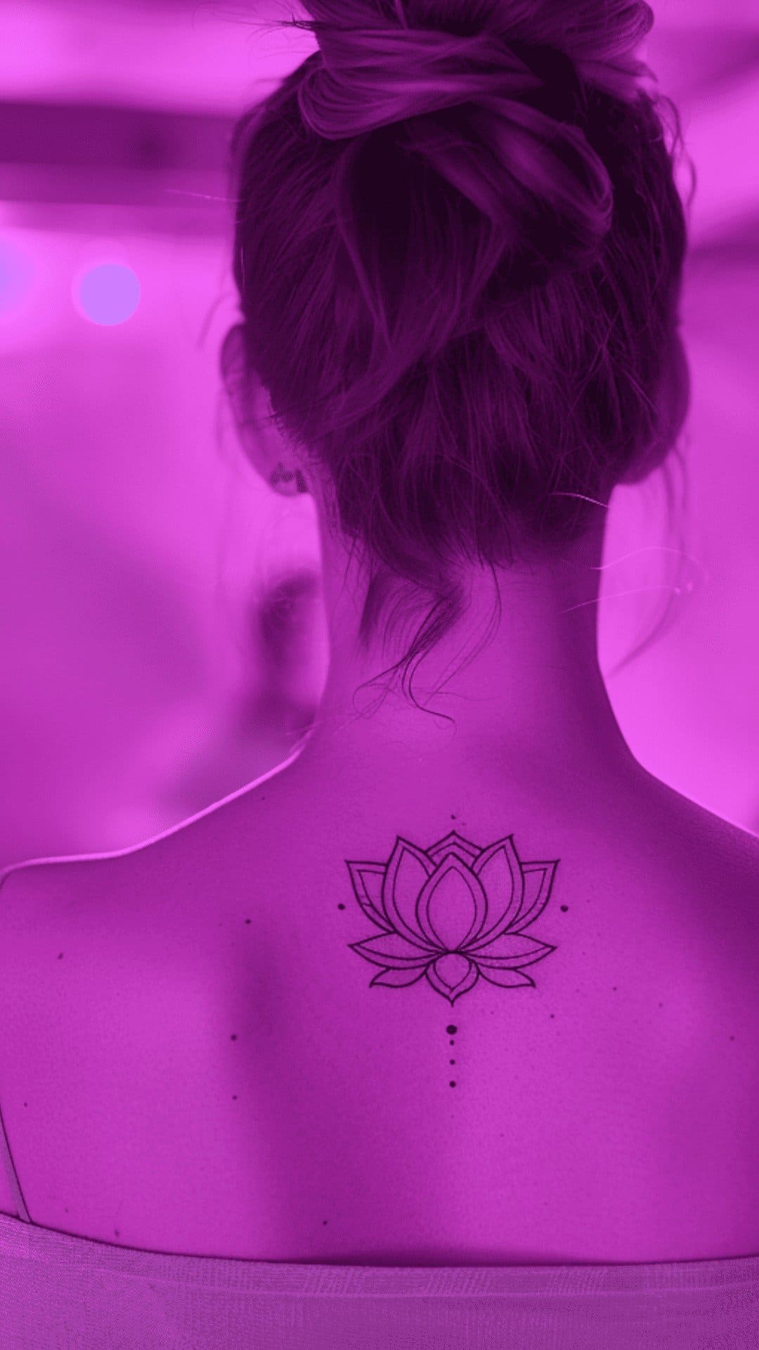 Fineline minimalist lotus tattoo under neck on the back looks beautiful.