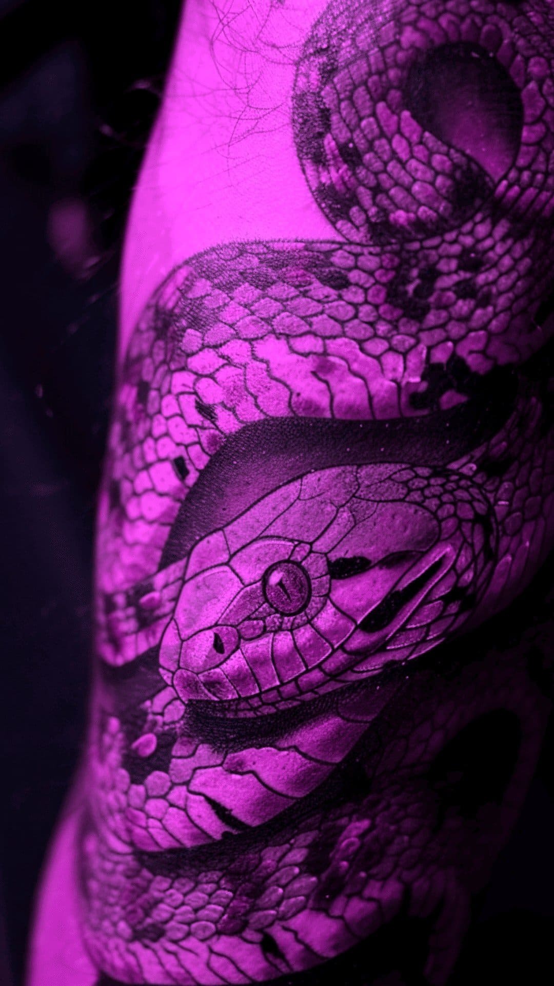 Highly detailed snake tattoo on male's arm is so captivating!